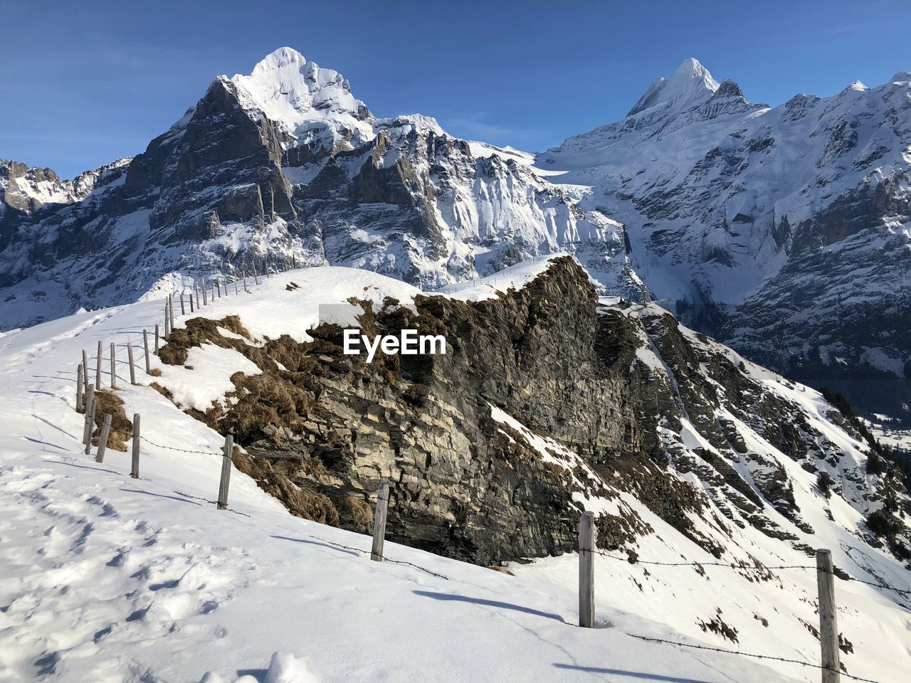 SNOW COVERED MOUNTAINS AGAINST SKY