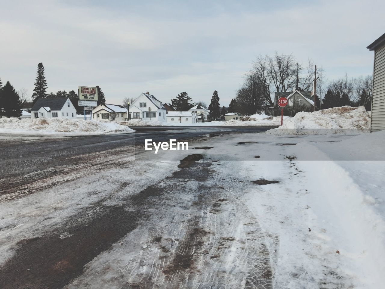 winter, snow, cold temperature, architecture, built structure, building exterior, sky, nature, building, freezing, frozen, tree, house, ice, environment, no people, day, cloud, landscape, blizzard, outdoors, city, scenics - nature, water, white, land, winter storm, residential district, plant