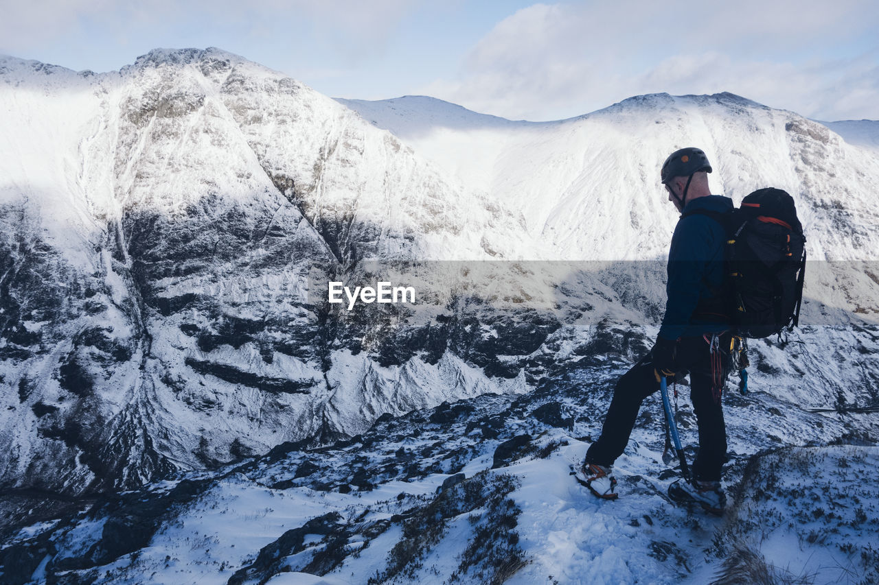 Man standing on snow covered mountain