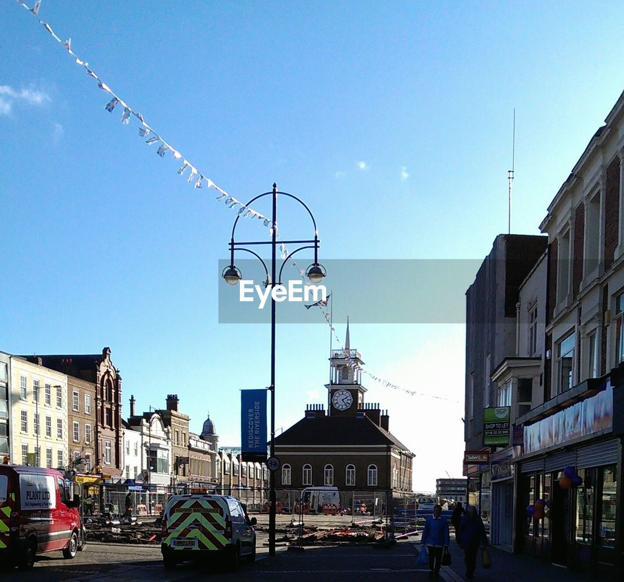 LOW ANGLE VIEW OF CITY STREET AGAINST SKY