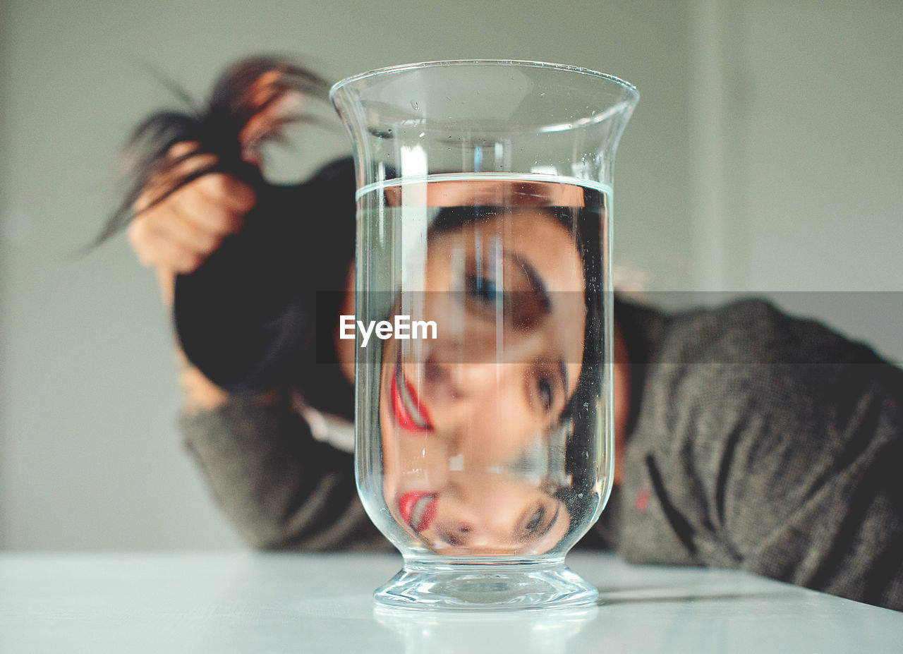 PORTRAIT OF MAN HOLDING GLASS WITH WATER