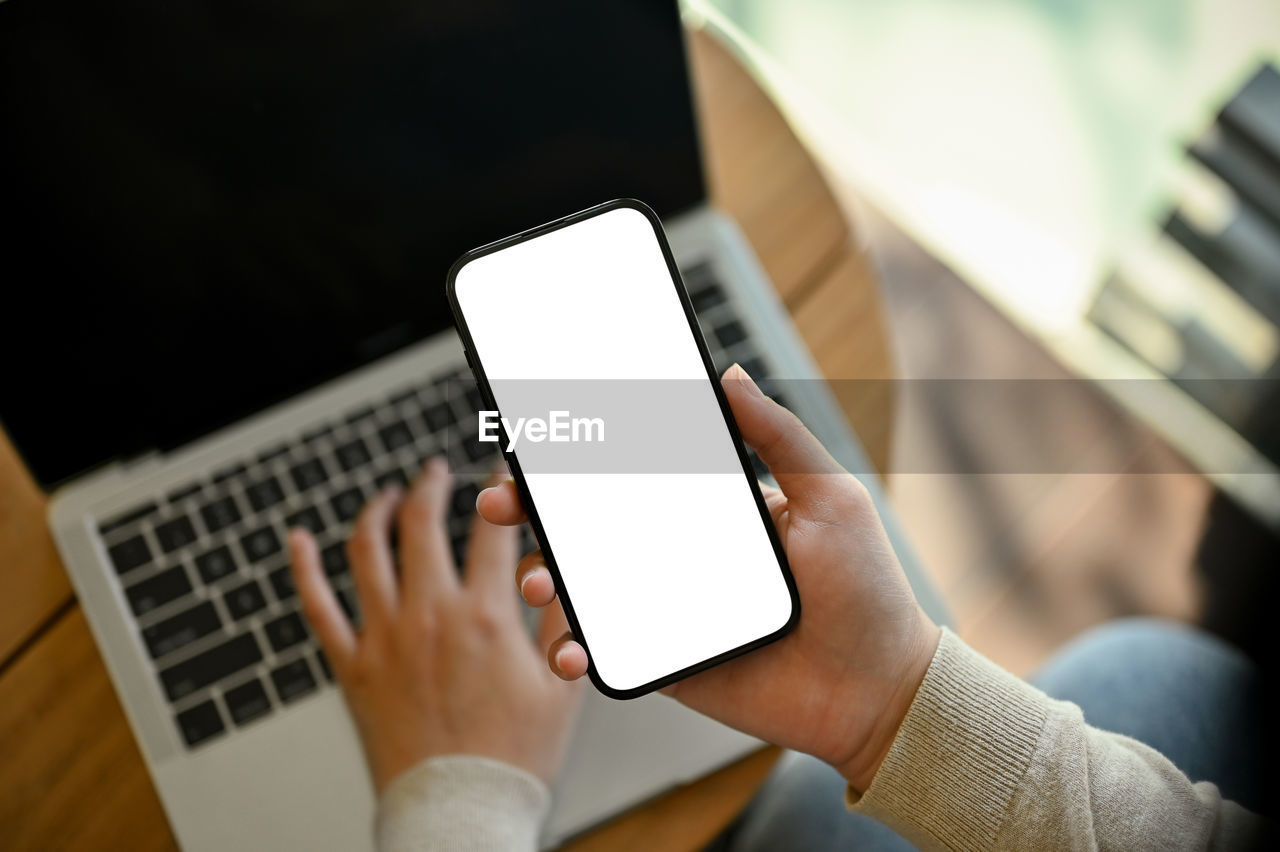 midsection of woman using laptop
