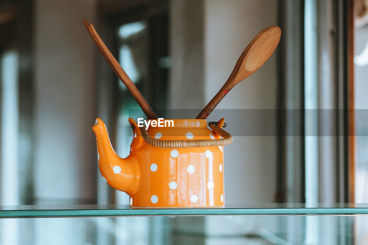 Close-up of orange art on table