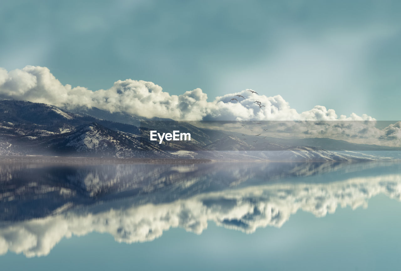 IDYLLIC SHOT OF SNOWCAPPED MOUNTAINS AGAINST SKY