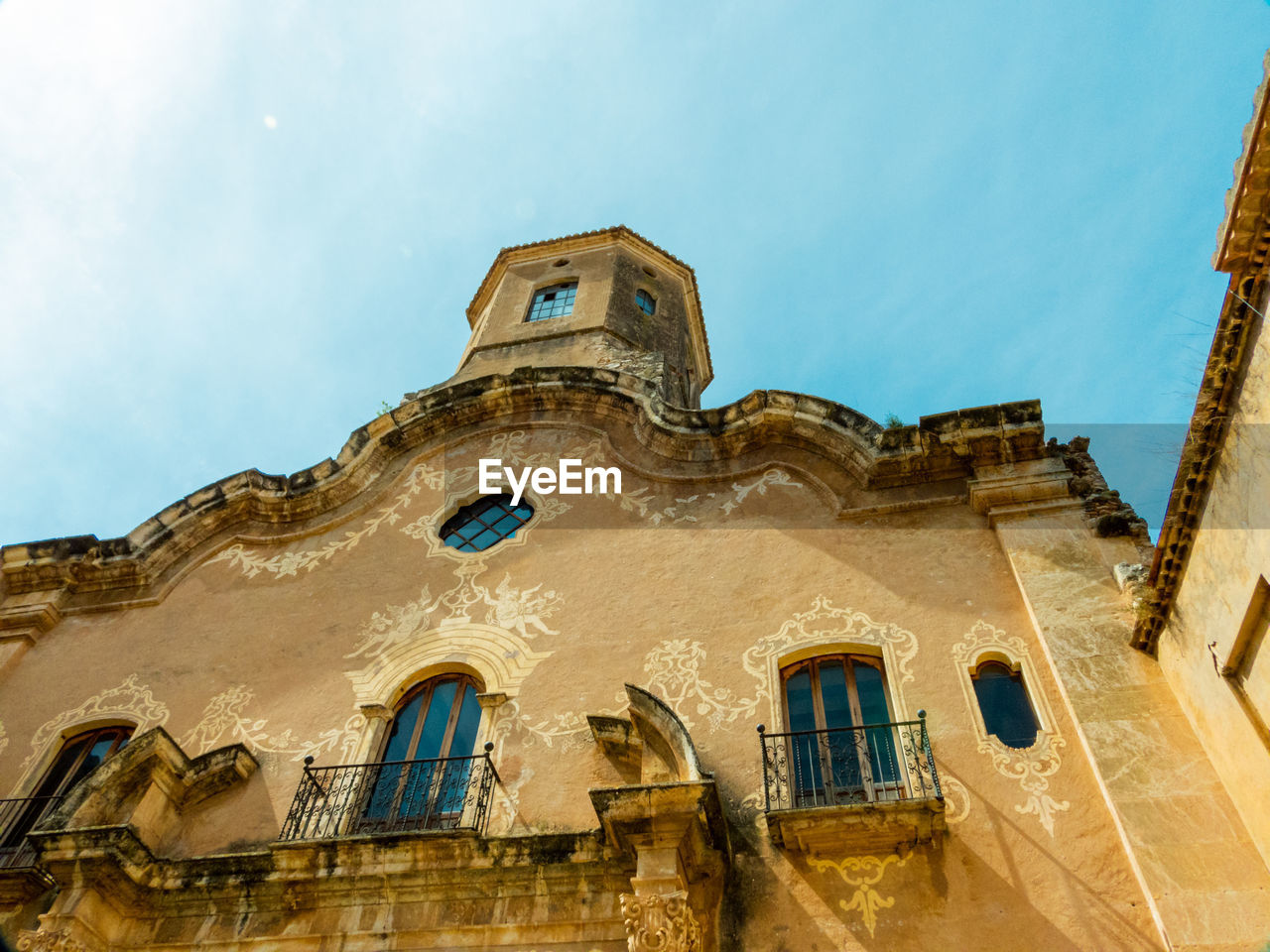 architecture, building exterior, built structure, low angle view, building, sky, history, ancient history, the past, nature, no people, window, travel destinations, religion, place of worship, landmark, belief, day, outdoors, city, spirituality, facade, travel, old, house, cloud, tower, temple, tourism, blue