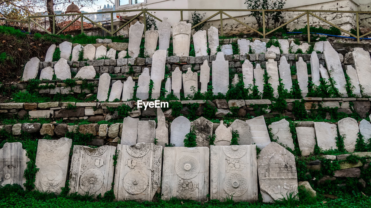 Rows of thombs, statues and funerary plates inside the ancient city of smyrna, izmir, turkey