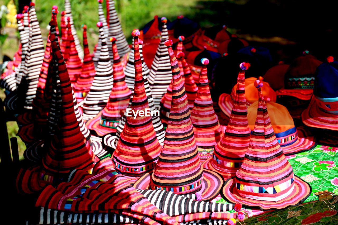 HIGH ANGLE VIEW OF ILLUMINATED LANTERNS IN MARKET STALL