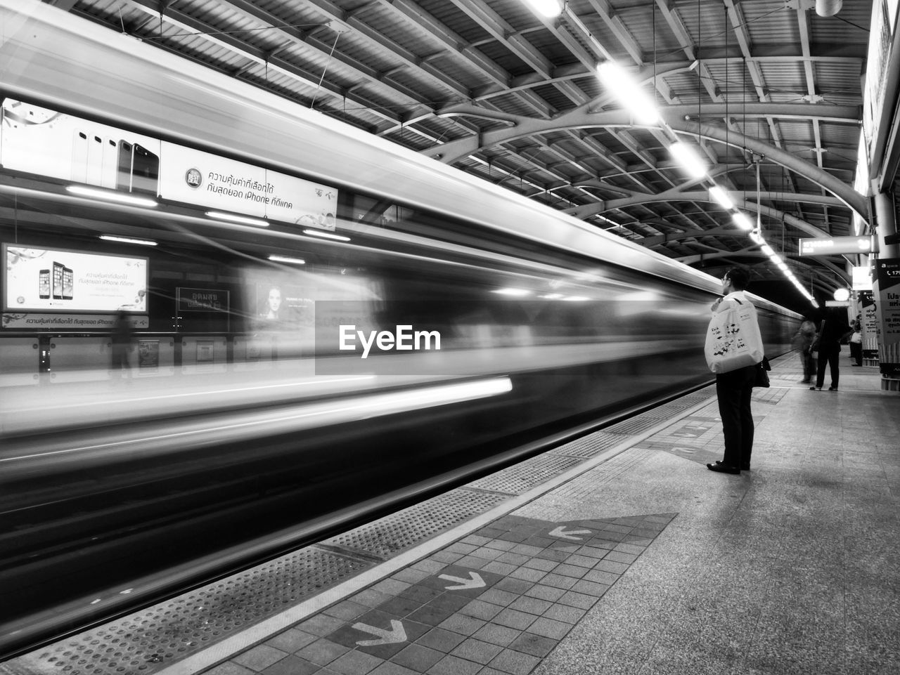 BLURRED MOTION OF SUBWAY TRAIN AT STATION