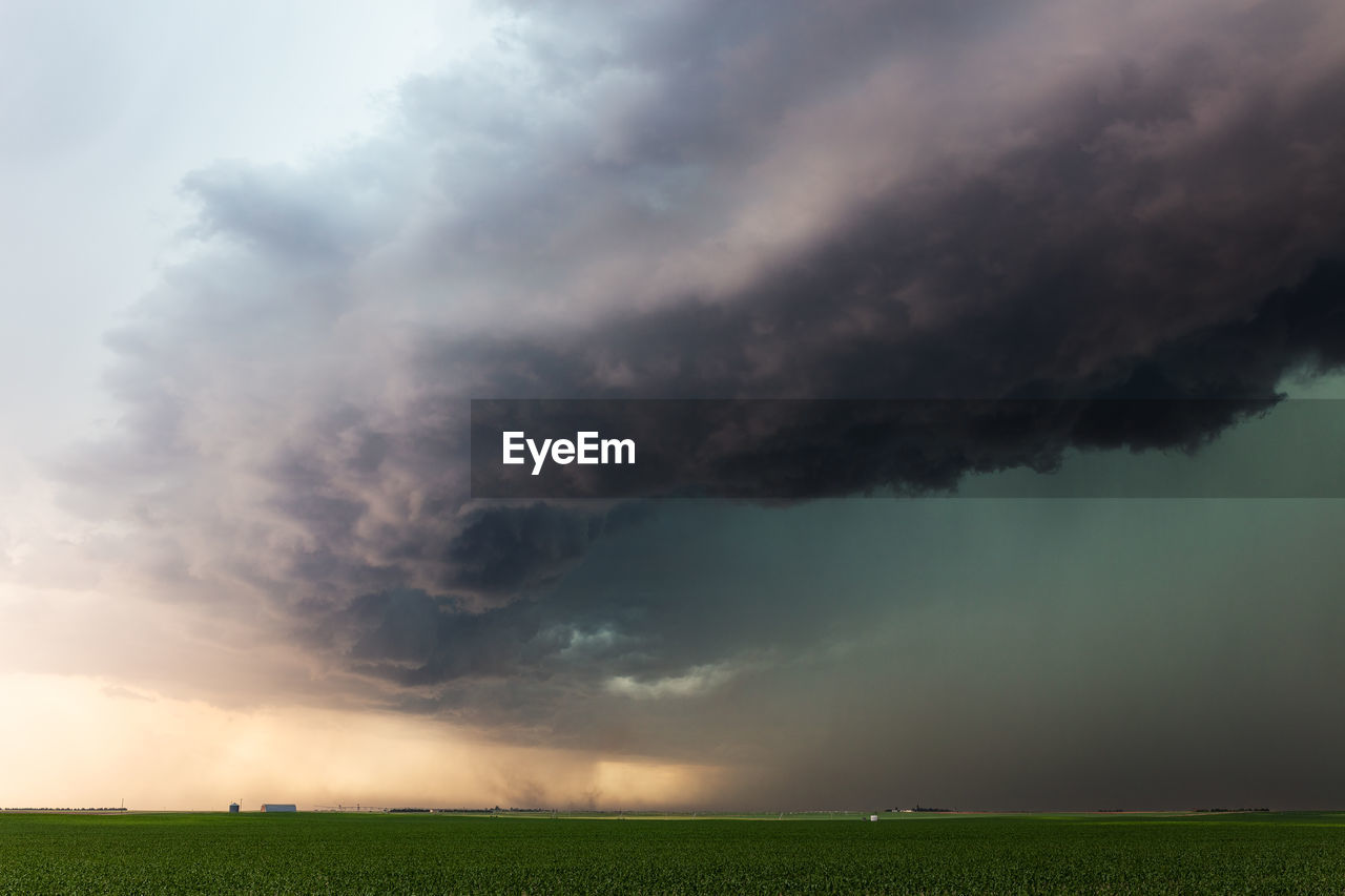 Dramatic thunderstorm clouds roll over a field near dalton, nebraska