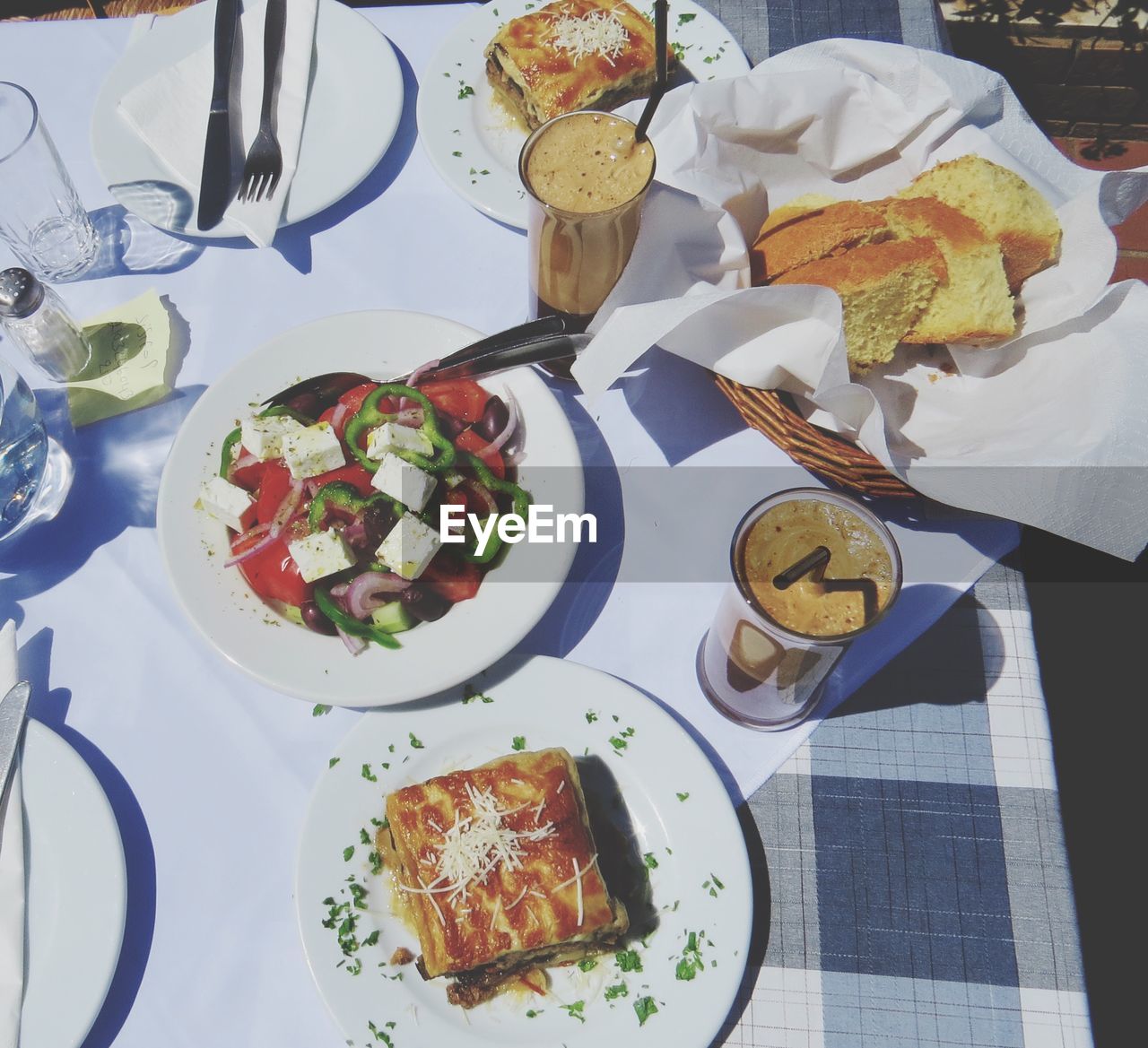 Directly above shot of coffees with fried vegetables on table