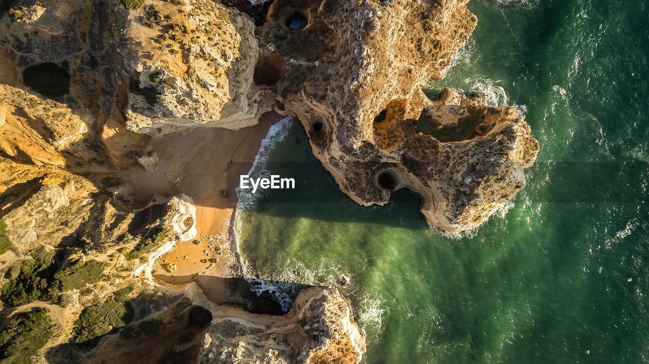 Aerial view of rock formations at beach