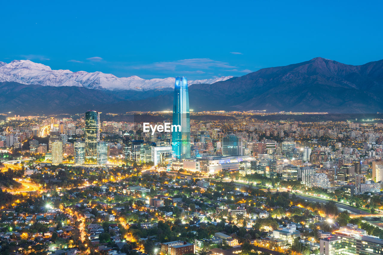 Skyline of santiago de chile at the foots of the andes mountain range and buildings at providencia.