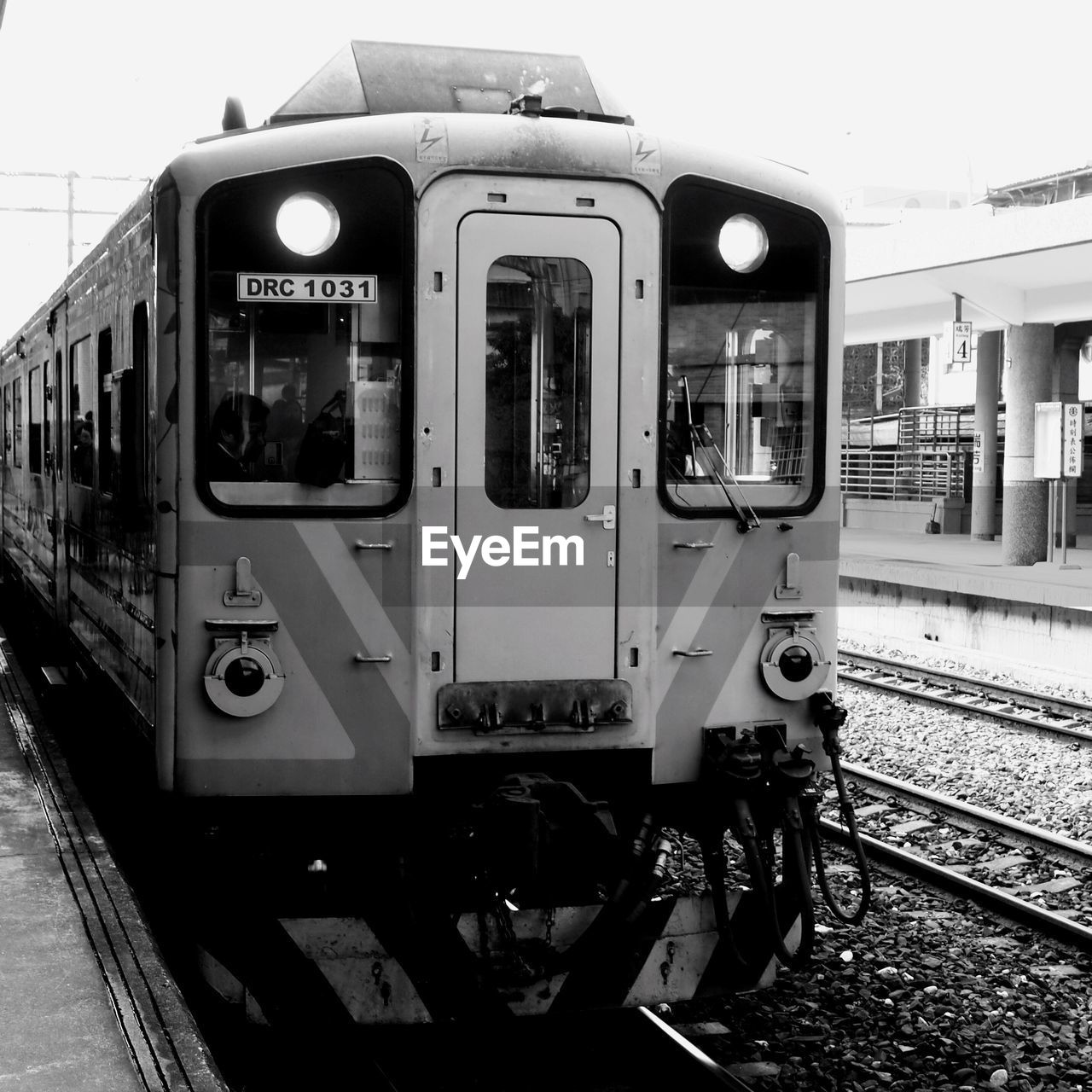 TRAIN AT RAILROAD STATION PLATFORM