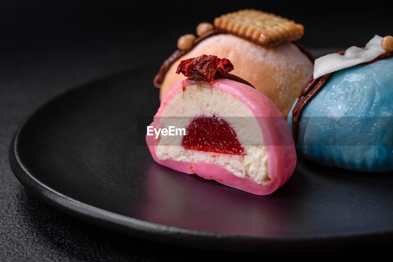 food and drink, food, dessert, freshness, black background, indoors, sweetness, plate, produce, studio shot, sweet food, no people, healthy eating, fruit, still life, sweet, wellbeing, close-up, baked