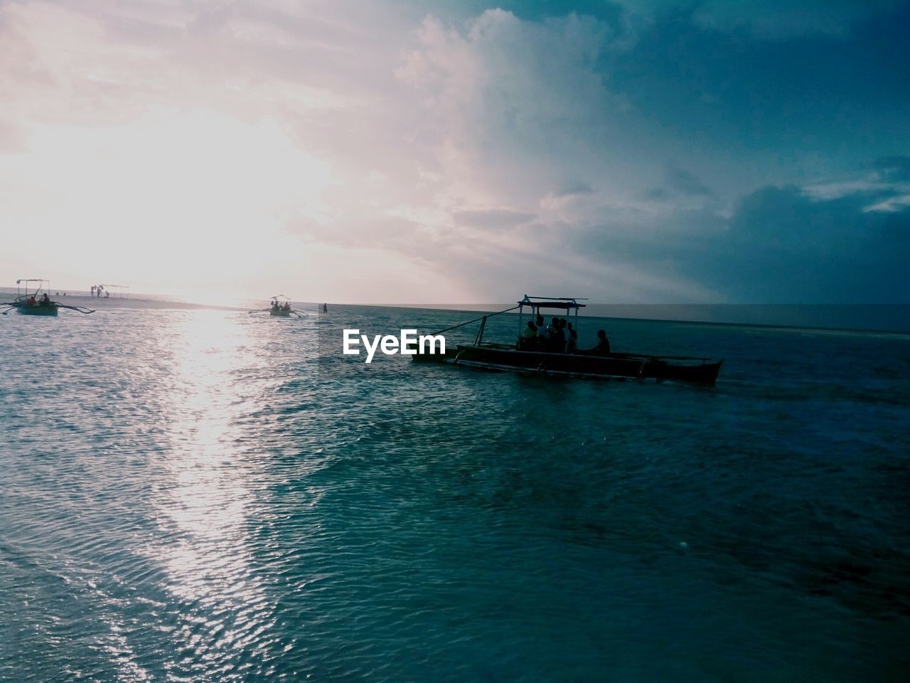 Side view of boat in calm blue sea against sky