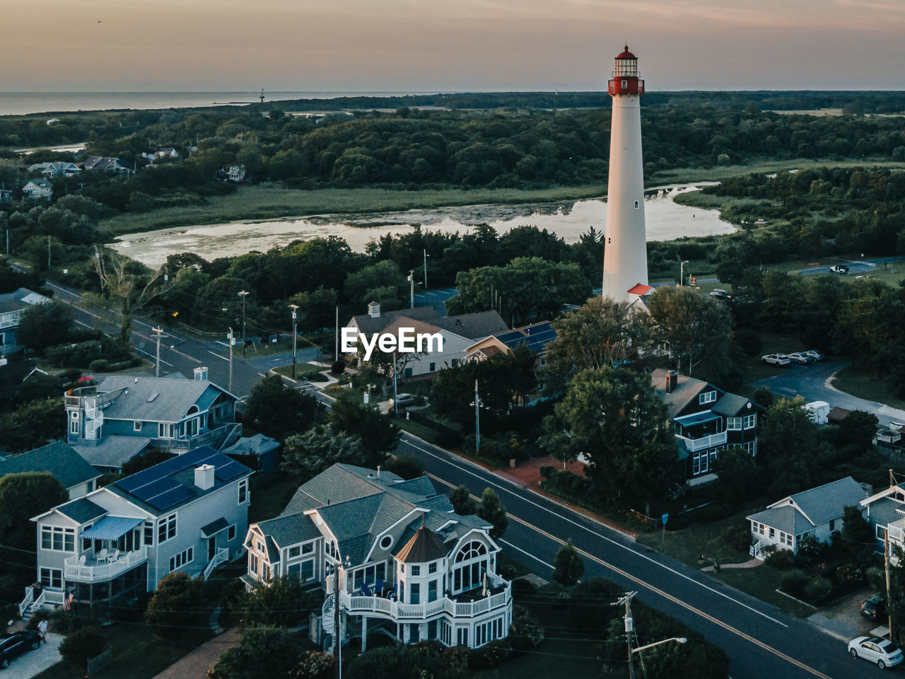 High angle view of road amidst buildings in city. cape may new jersey lighthouse from above