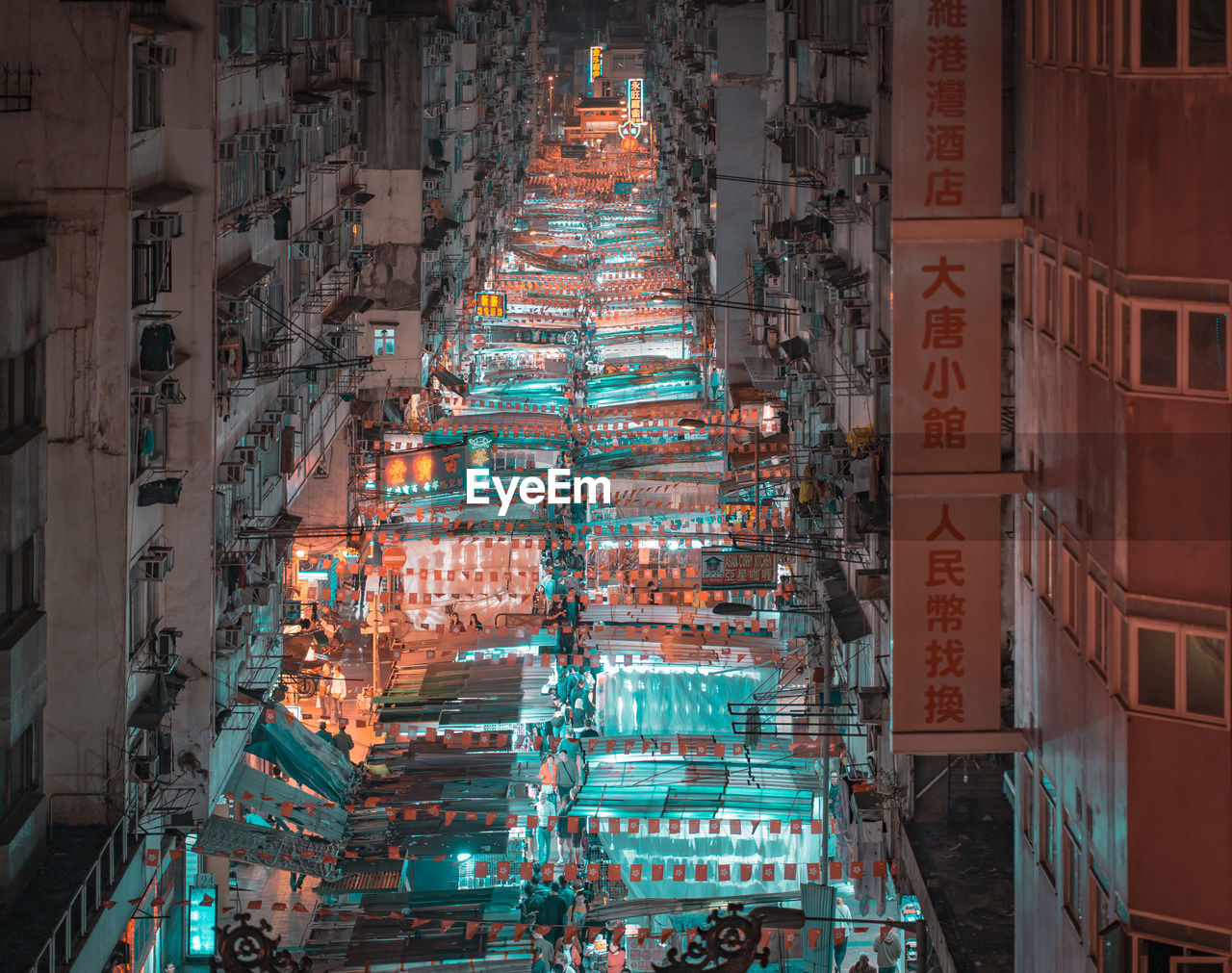 Buntings hanging in illuminated city at night