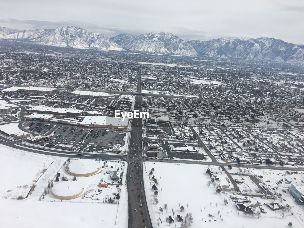 HIGH ANGLE VIEW OF SNOW COVERED MOUNTAINS