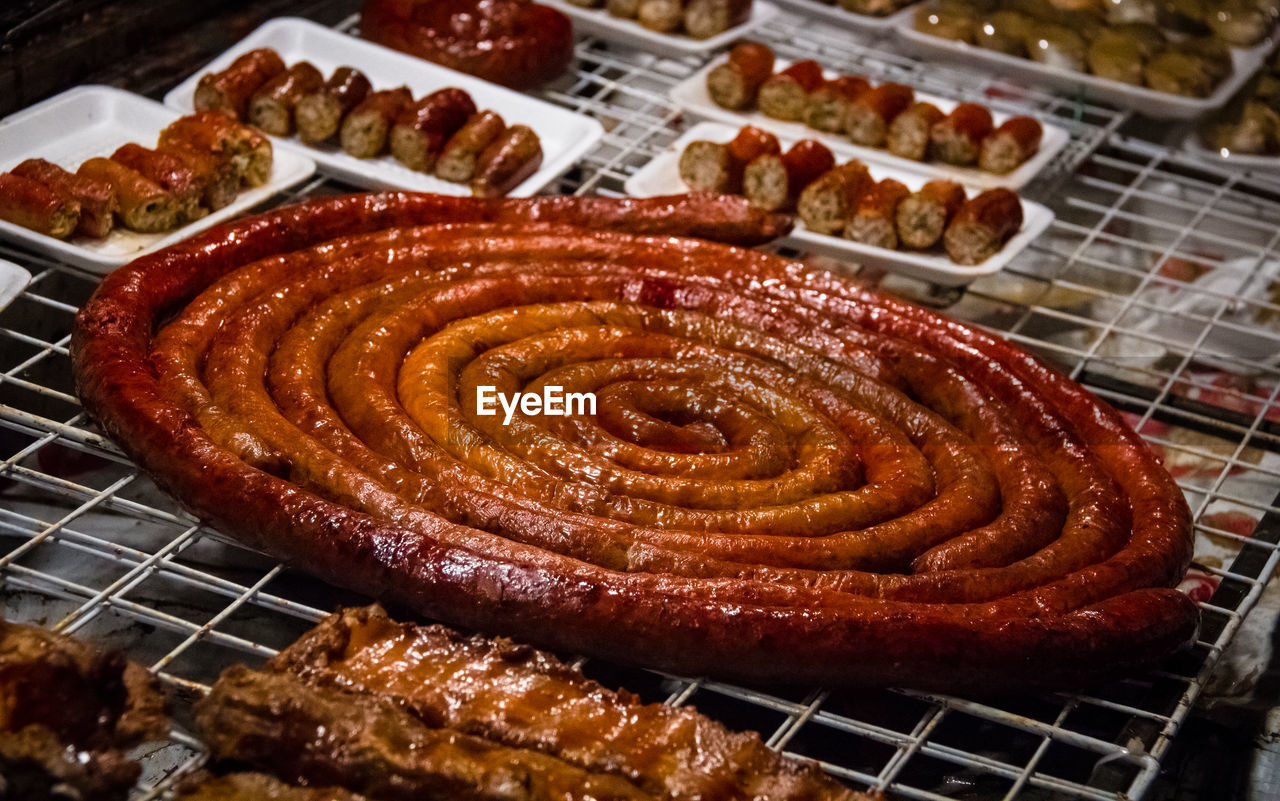 Close-up of spiral shape thai pork sausage sold in night market