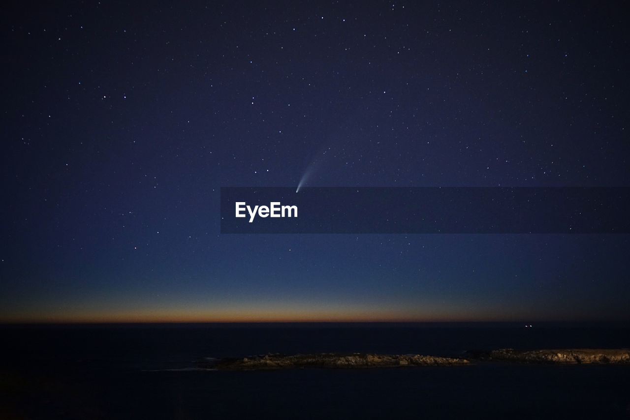 Comet neowise over the night sky of the galician coast