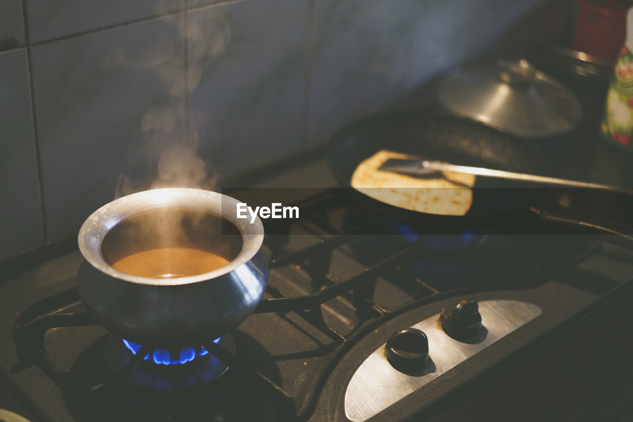 Food cooking on stove at kitchen