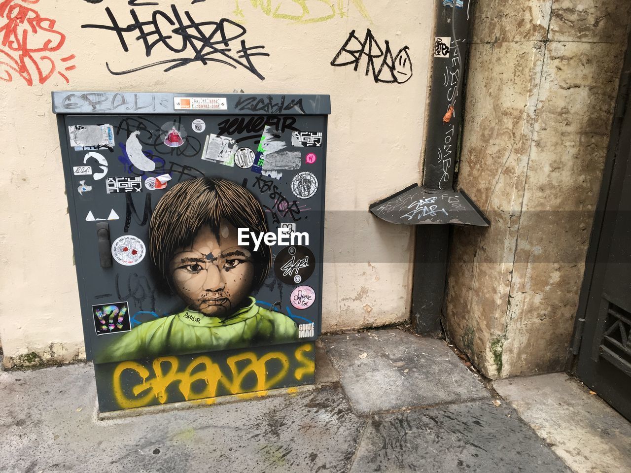 PORTRAIT OF BOY ON WALL