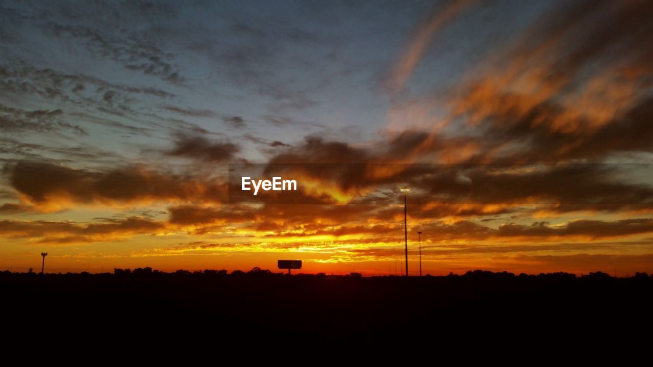 SCENIC VIEW OF SILHOUETTE ELECTRICITY PYLON AGAINST SKY DURING SUNSET