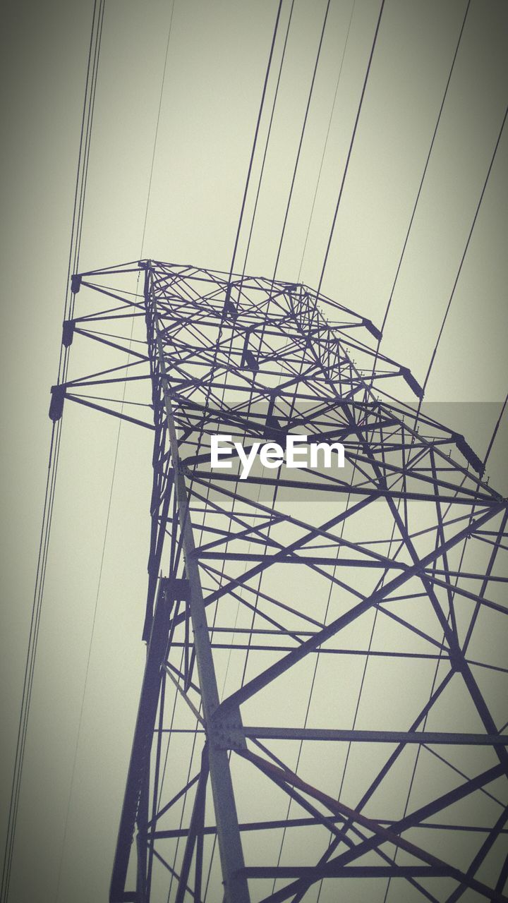 LOW ANGLE VIEW OF POWER LINES AGAINST THE SKY