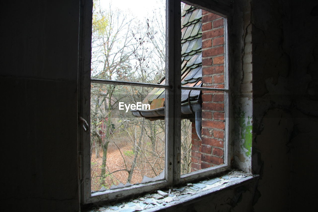 Tiled roof seen from window of abandoned house