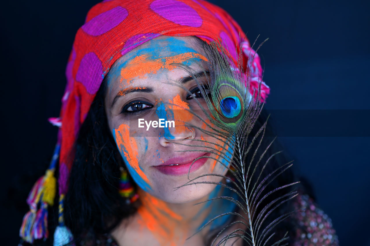 A young girl celebrating the festival of colours, holi.