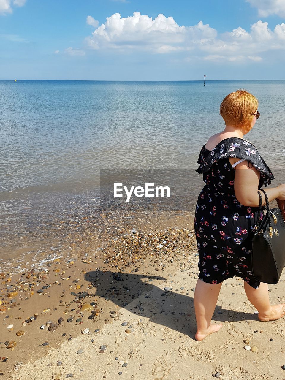 REAR VIEW OF GIRL ON BEACH