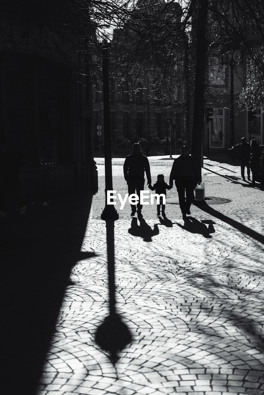 PEOPLE WALKING ON ROAD