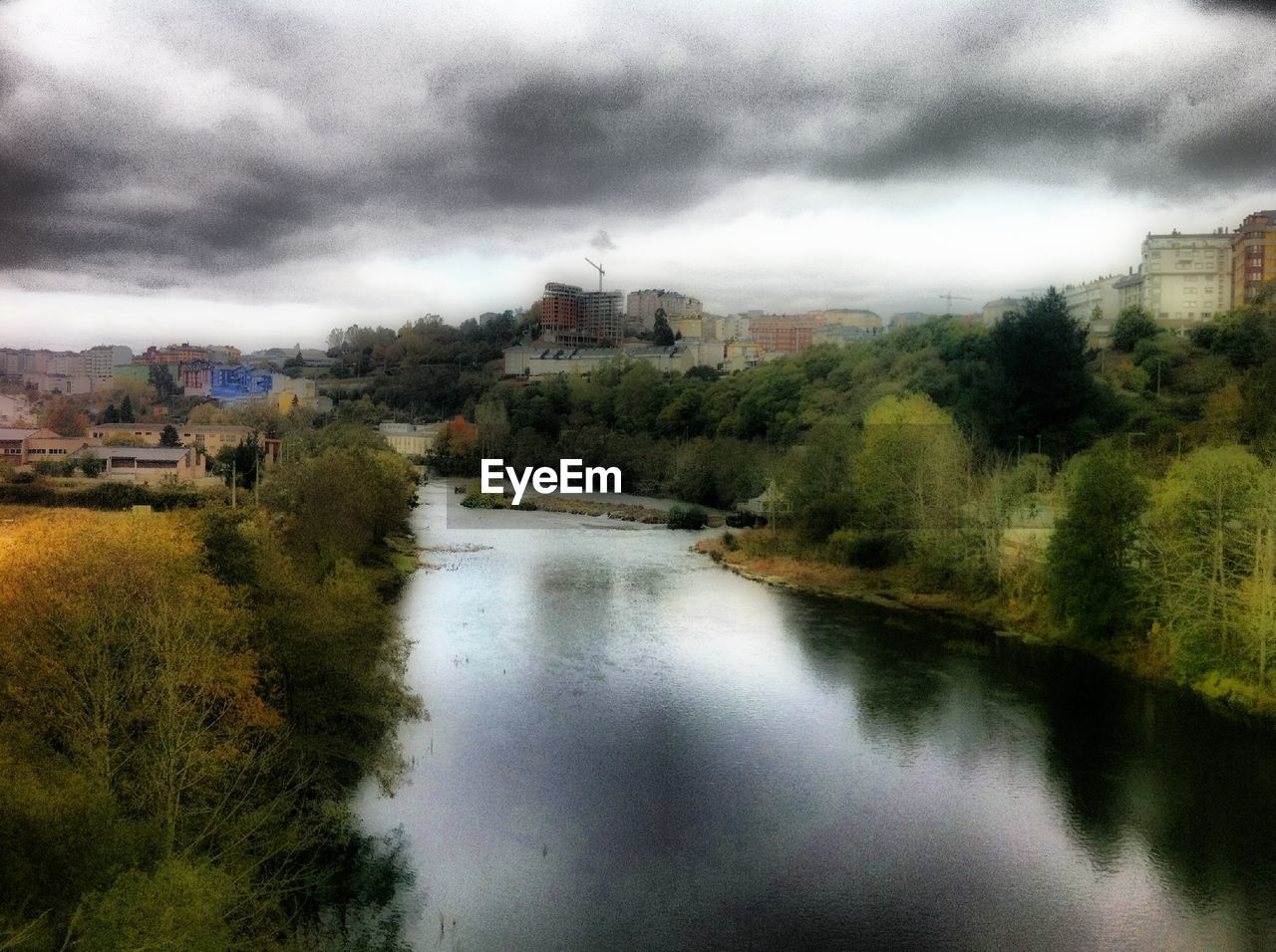 SCENIC VIEW OF LAKE AGAINST BUILDINGS