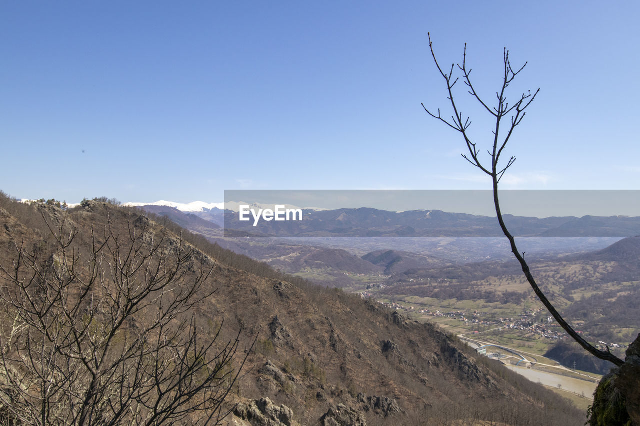 SCENIC VIEW OF ARID LANDSCAPE AGAINST SKY