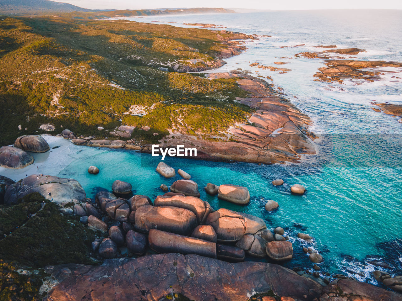 High angle view of rocks on sea shore