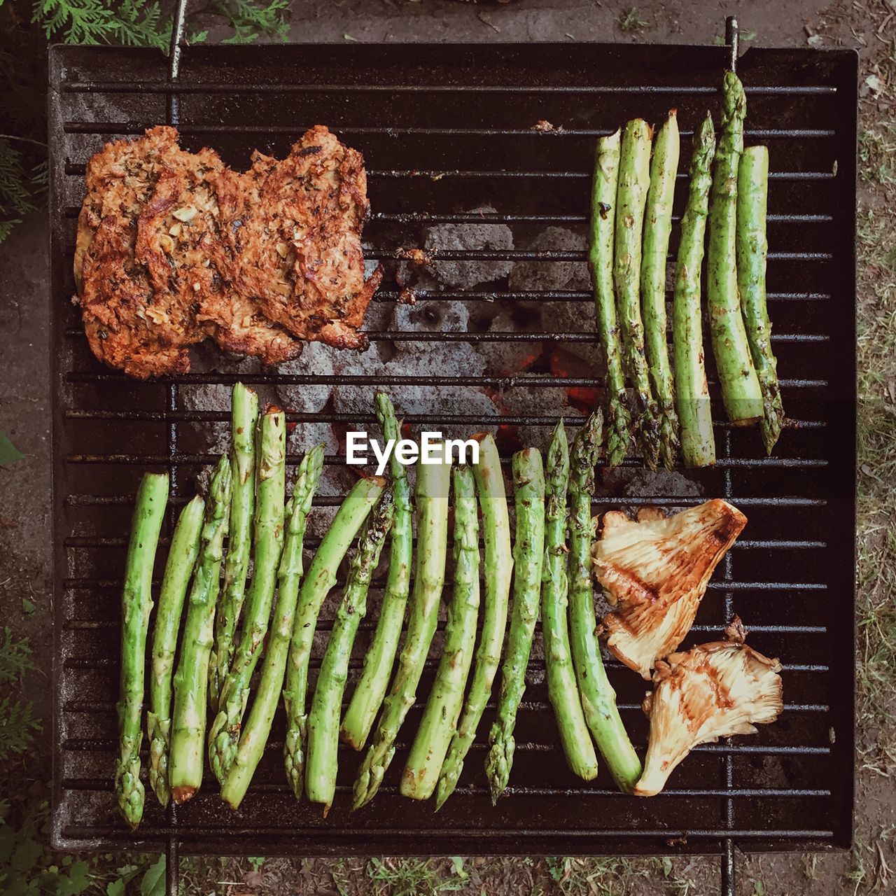 High angle view of soy meat and vegetables on barbecue grill