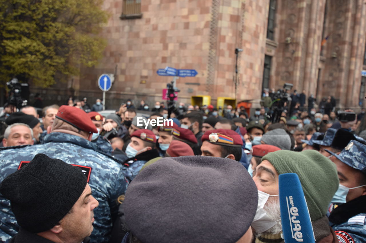 REAR VIEW OF PEOPLE ON STREET