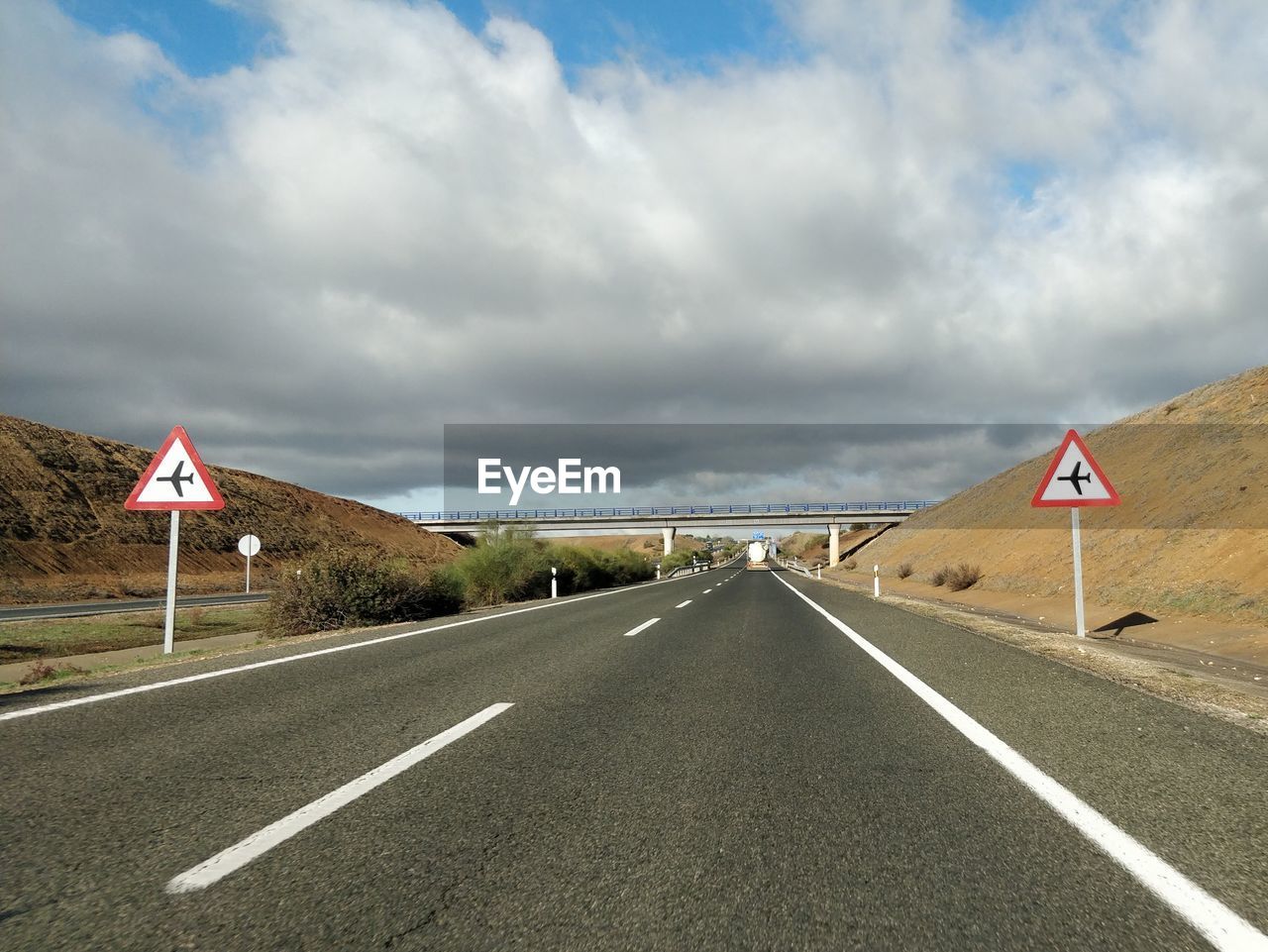 VIEW OF ROAD SIGN AGAINST SKY