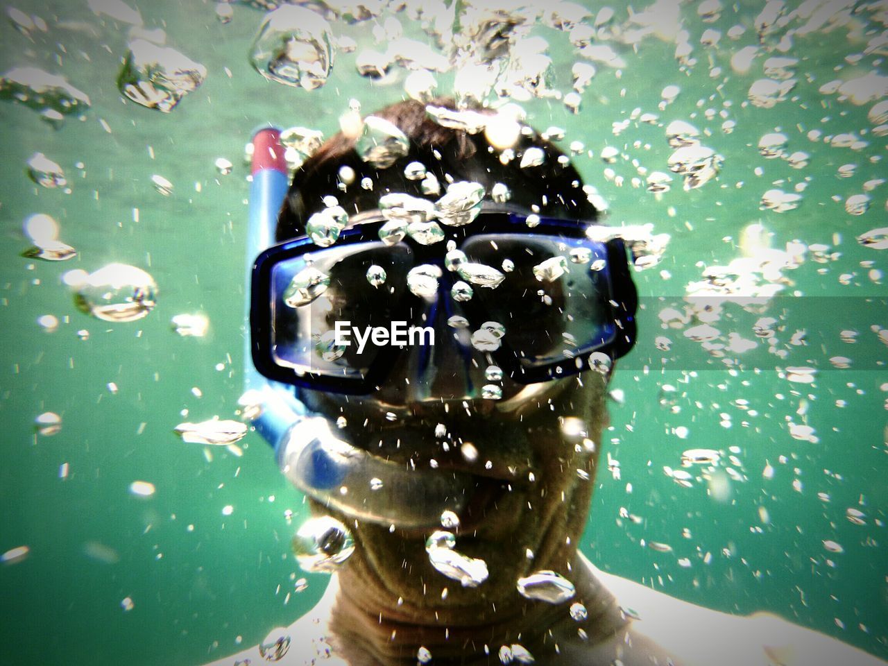 Close-up of man scuba diving in sea