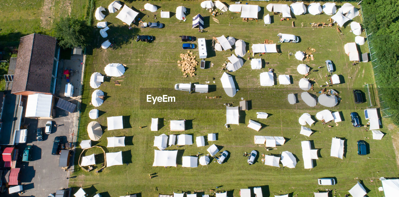 HIGH ANGLE VIEW OF CEMETERY AND BUILDING IN YARD