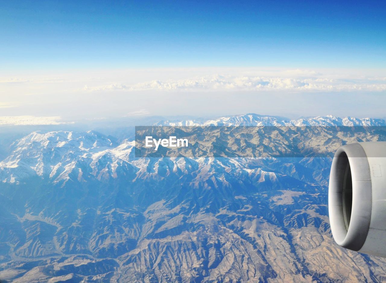AERIAL VIEW OF MOUNTAIN AGAINST SKY