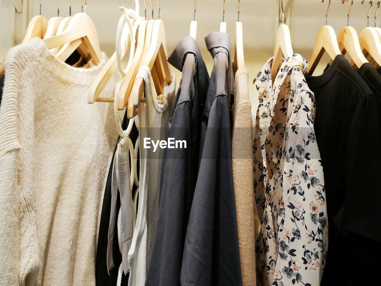 PANORAMIC VIEW OF CLOTHES HANGING IN STORE