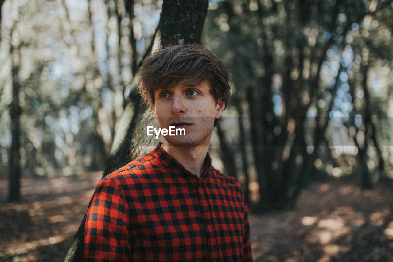 PORTRAIT OF MAN IN PARK