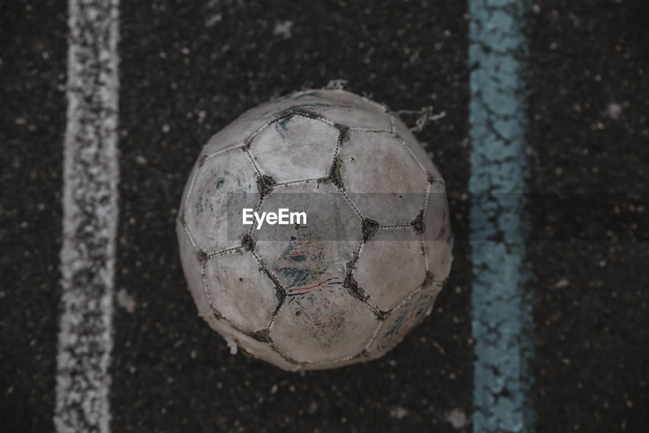 Directly above shot of soccer ball on street