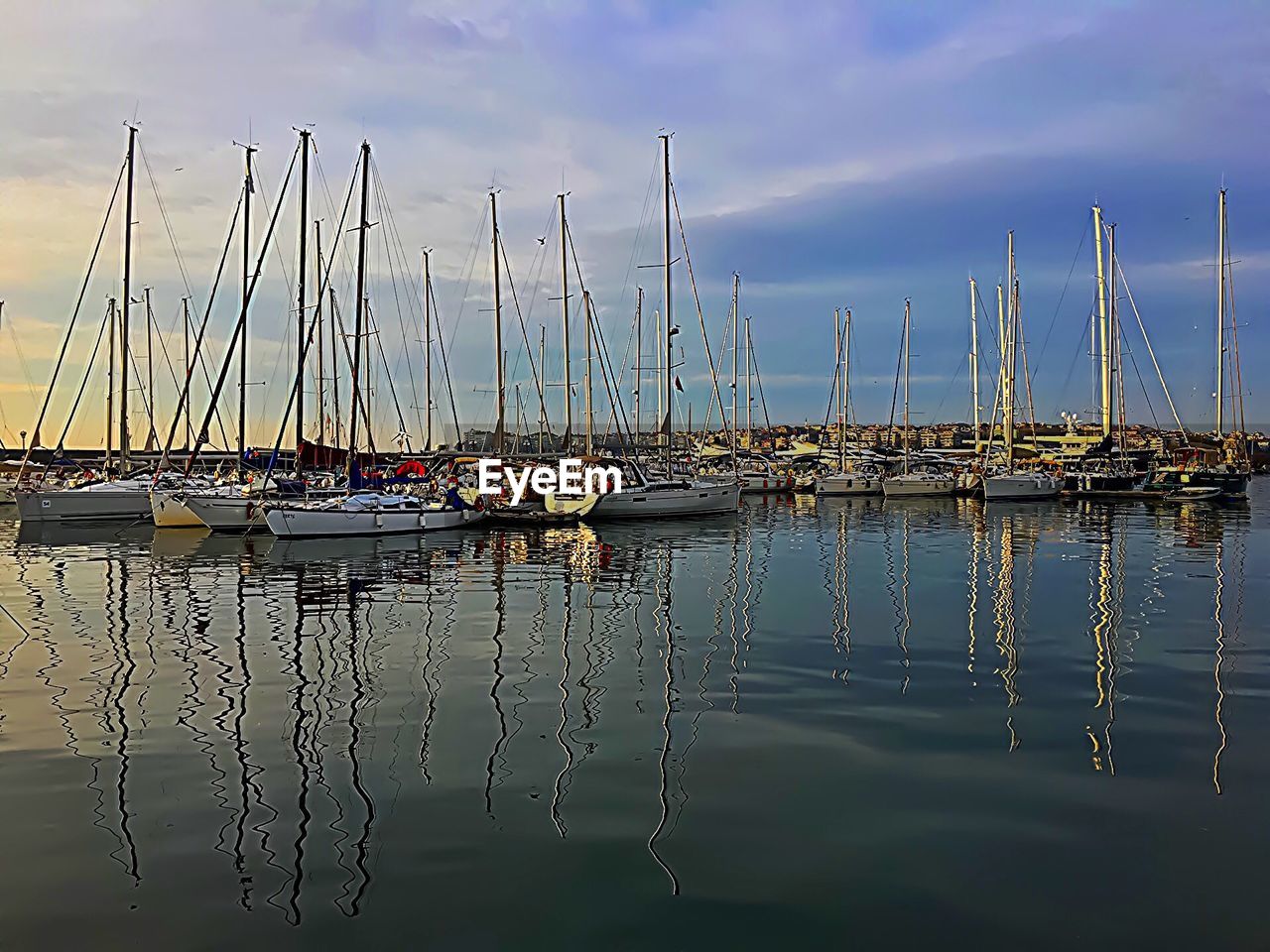 Boats moored at harbor