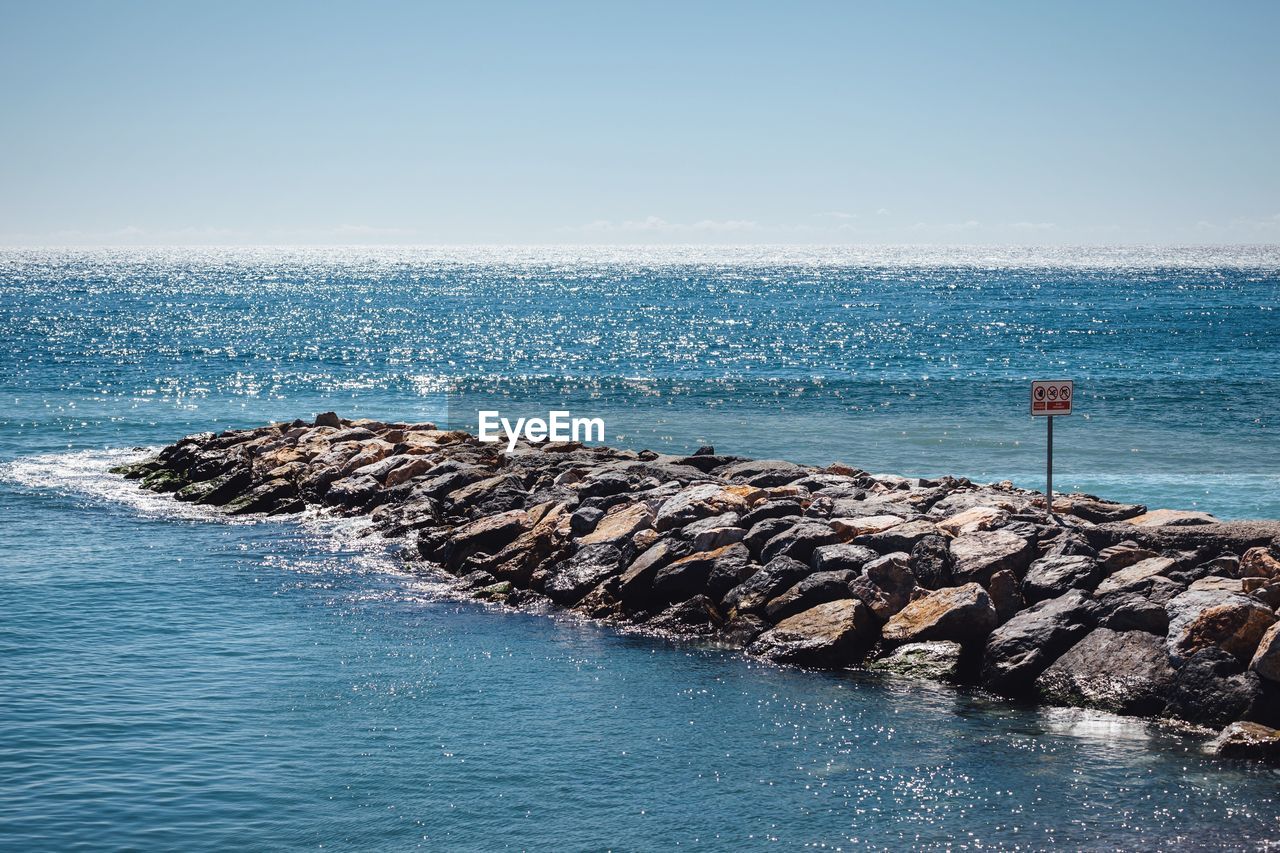 Rocky pier in sea