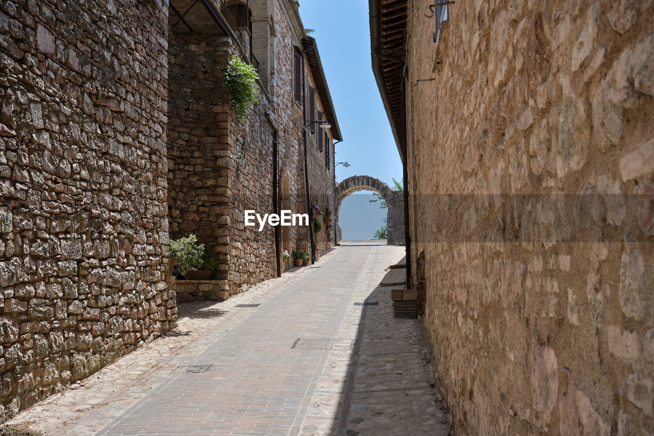 Alley with arch in the medieval town of spello umbria