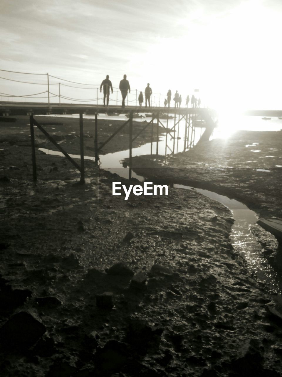 PEOPLE ON BEACH AGAINST SKY