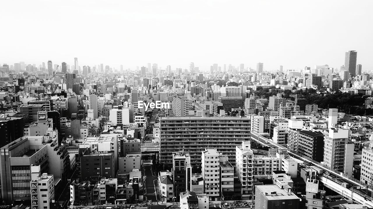 High angle view of buildings in city against sky