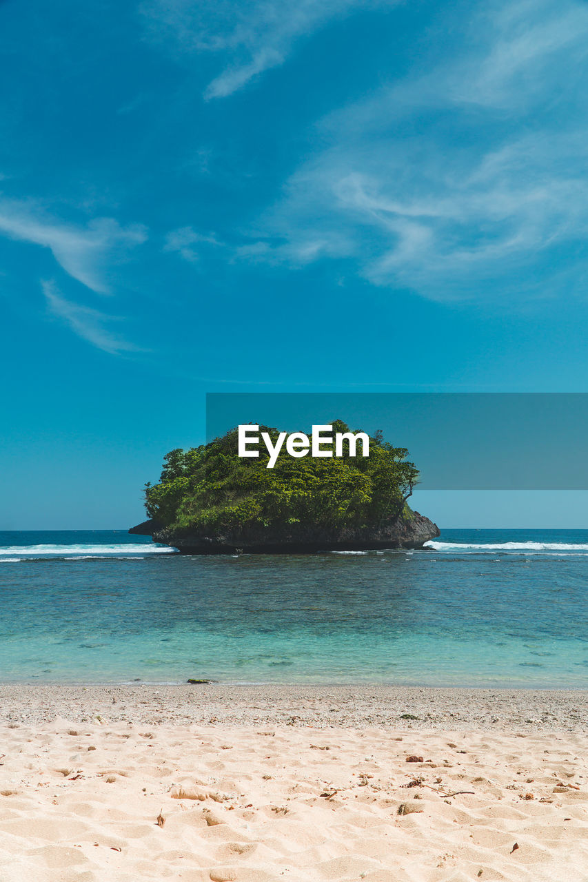 Scenic view of sea against blue sky